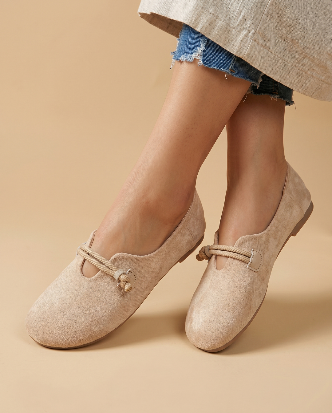 beige suede slip-on loafers, on foot