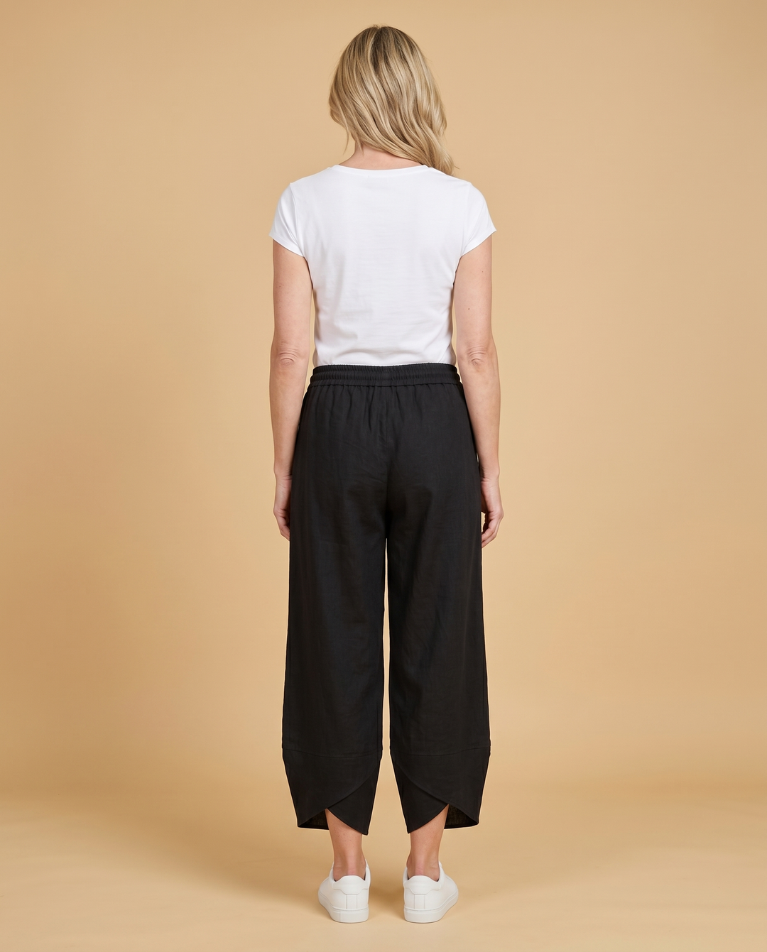 black wide-leg petal-hem pants back