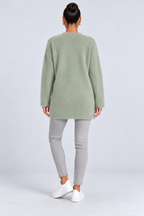 Elegant knitted cardigan — green-back studio view